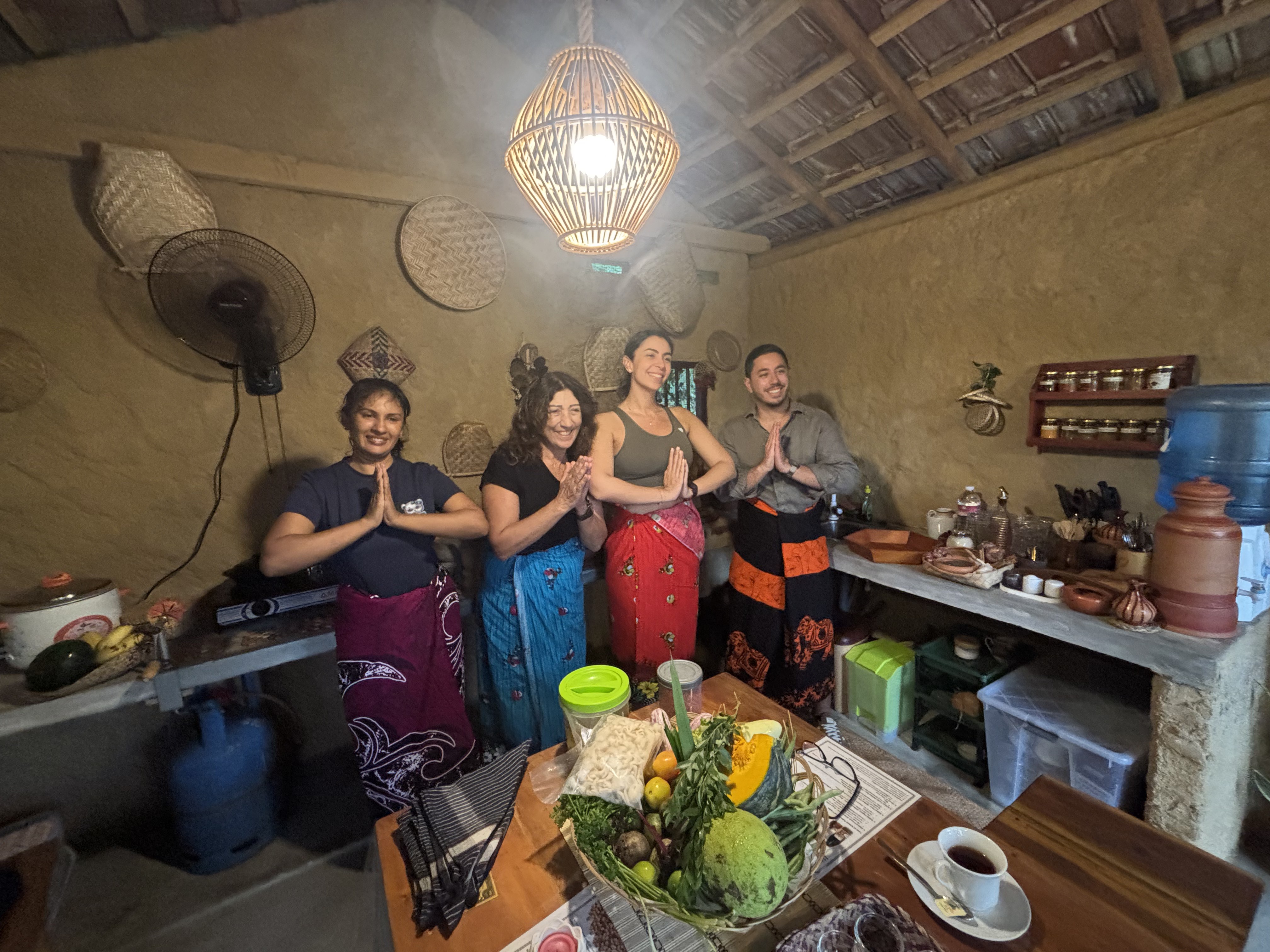 Warm Sri Lankan welcome — Ayubowan greeting in traditional sarongs